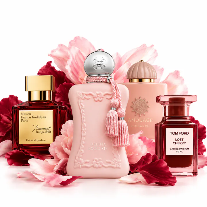 Baccarat Rouge 540, Parfums de Marly Delina, Amouage and Tom Ford Lost Cherry bottles among pink peonies